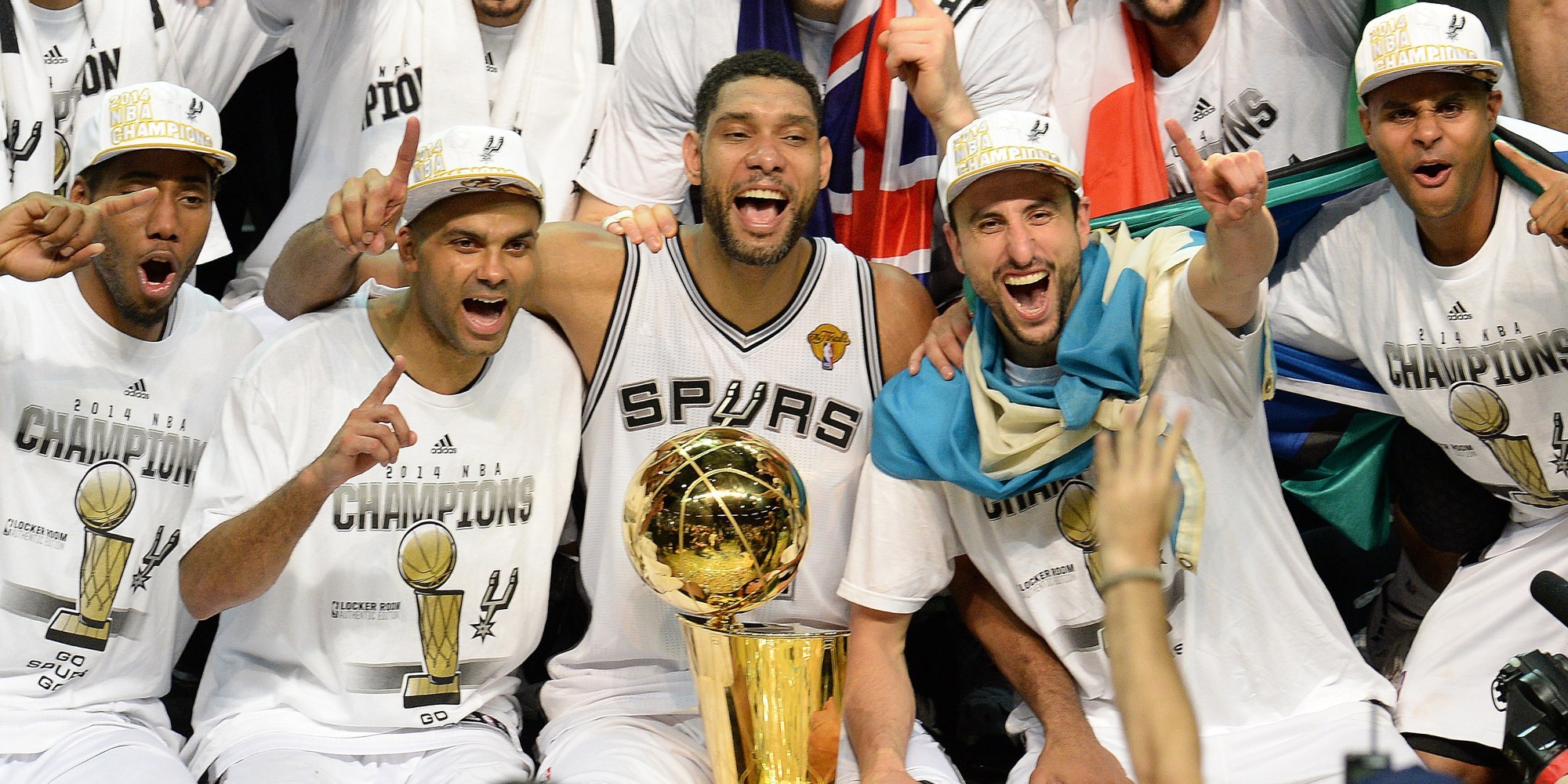 The San Antonio Spurs celebrate with the Larry O'Brien NBA Championship Trophy after the Spurs defeated the Miami Heat 107-84 in Game 5 of the NBA Finals to win the NBA Finals Championship, June 15, 2014 in San Antonio,Texas.  From left are: MVP Kawhi Leonard, Tony Parker, Tim Duncan, Manu Ginobili and Patty Mills.   The Spurs won the best of seven series 4-1.  AFP PHOTO / Robyn Beck        (Photo credit should read ROBYN BECK/AFP/Getty Images)